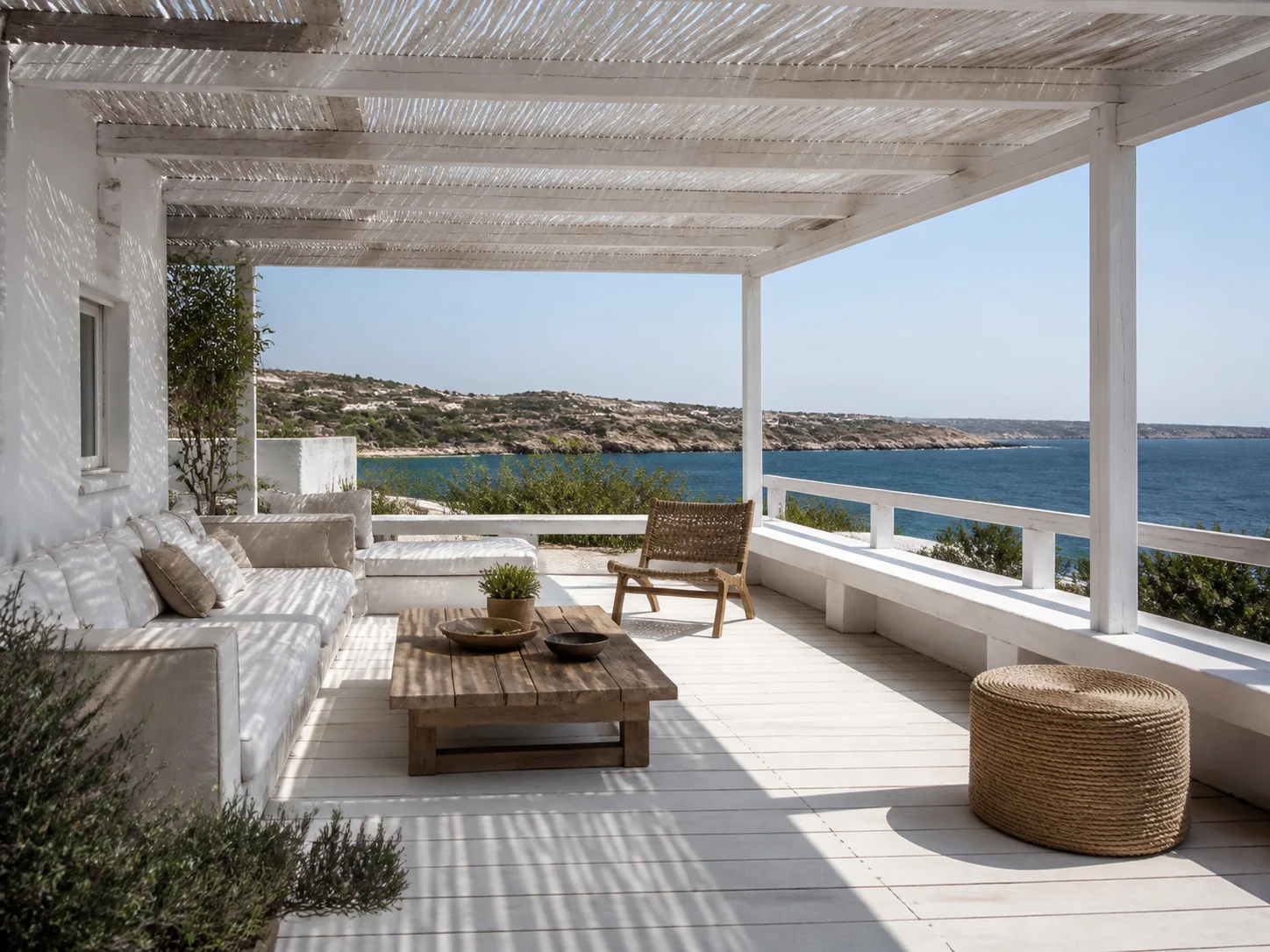 Coastal deck with whitewashed wood and a shade pergola