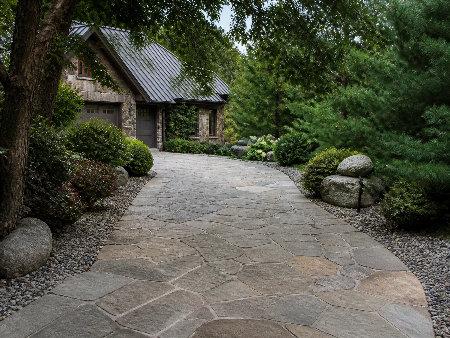 Natural stone paver driveway with gravel edge