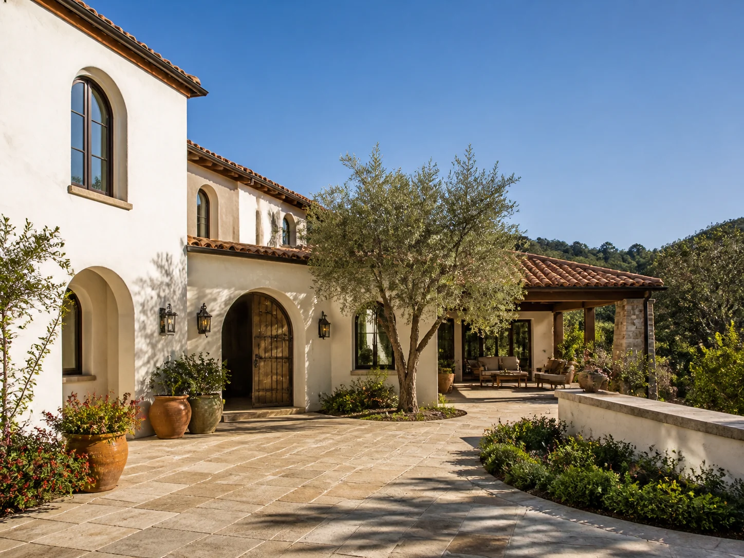 Mediterranean exterior with stucco walls and terracotta roof tile