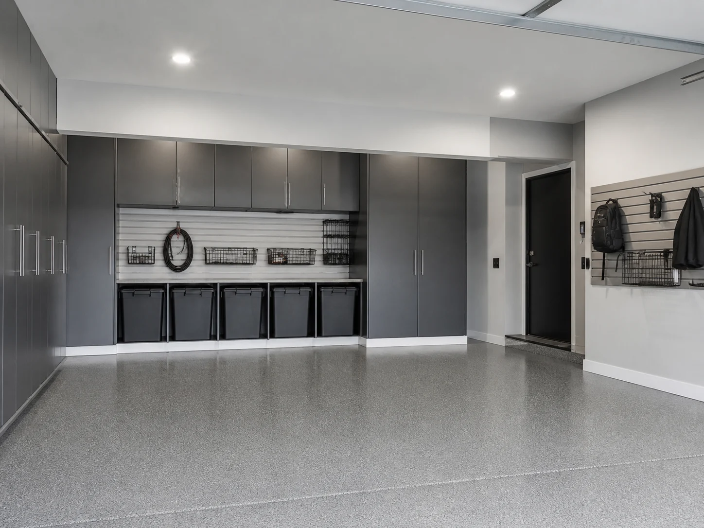 Minimalist organized storage garage with hidden bins
