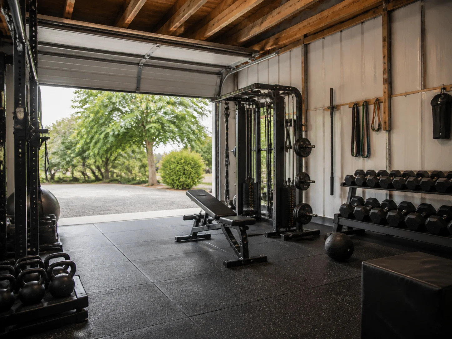 Workshop style garage converted into a home gym layout