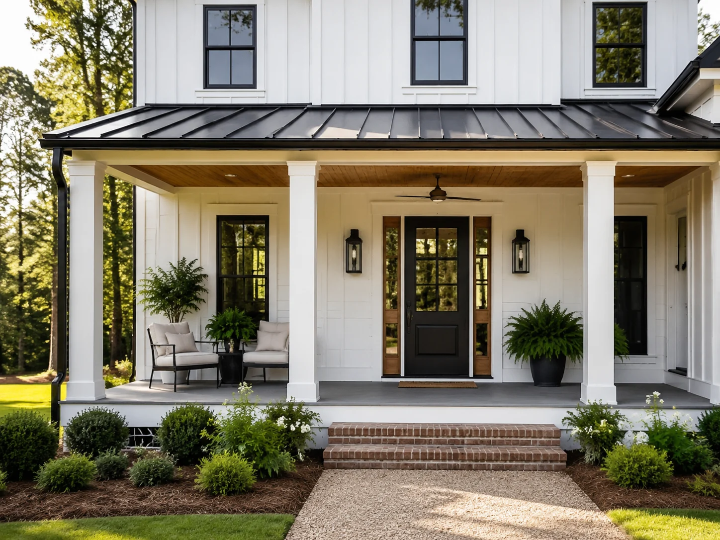 White house with a black-accented modern farmhouse front porch and square columns