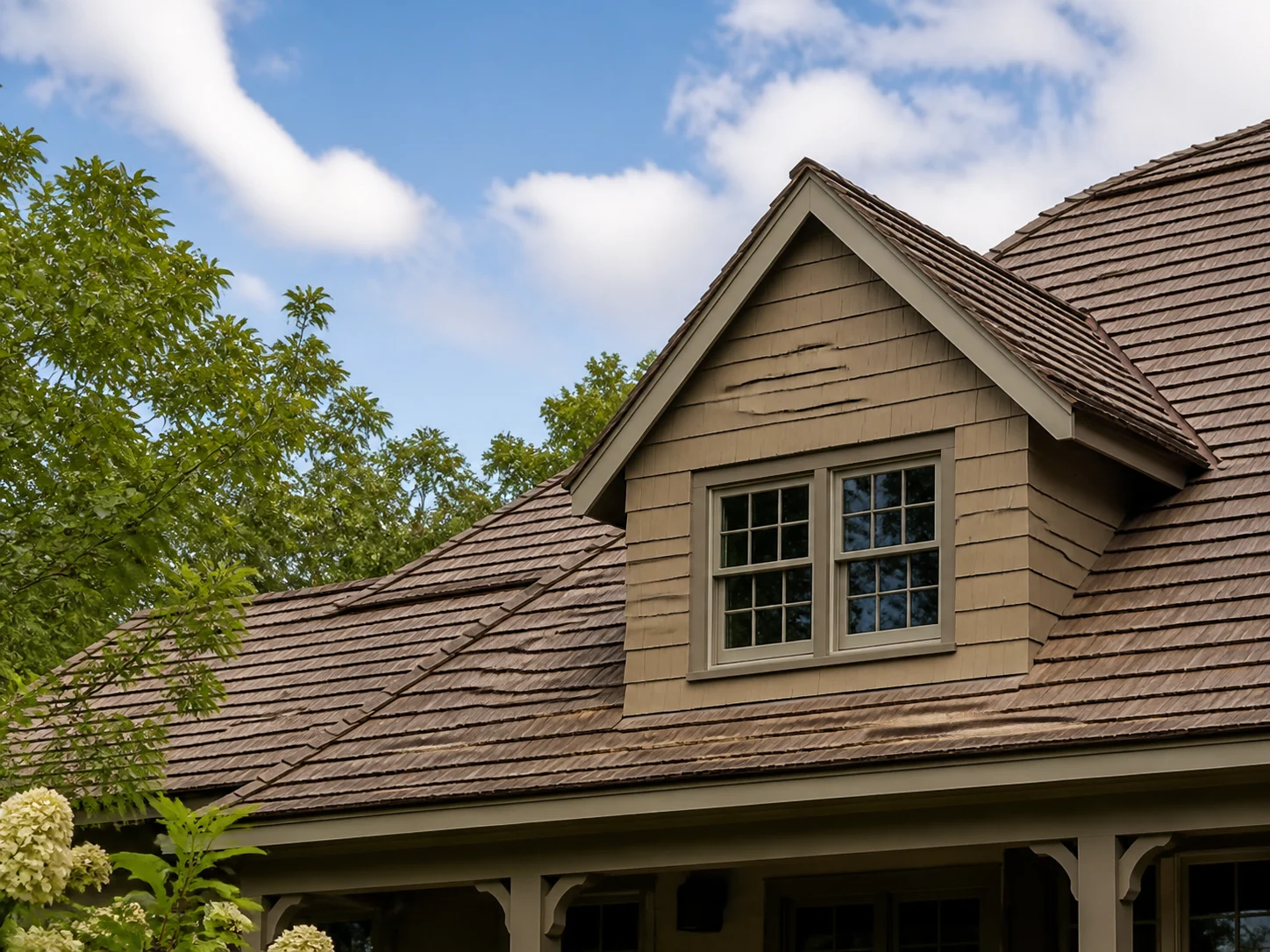 Traditional house with warm-toned architectural shingle roof