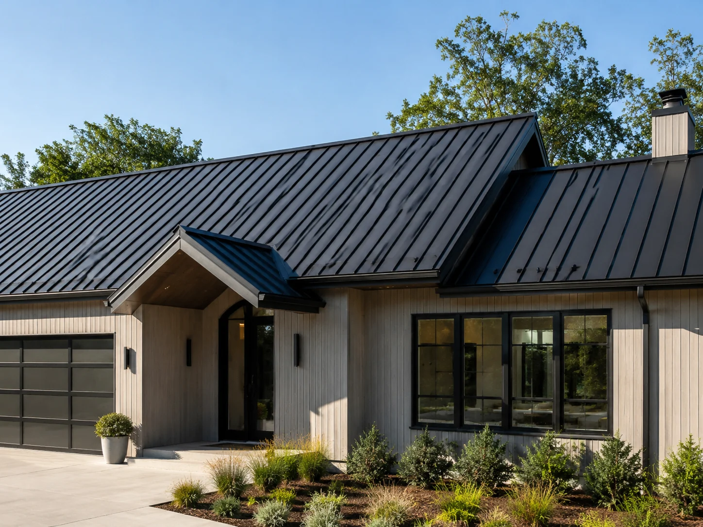 Modern house with a charcoal standing-seam metal roof