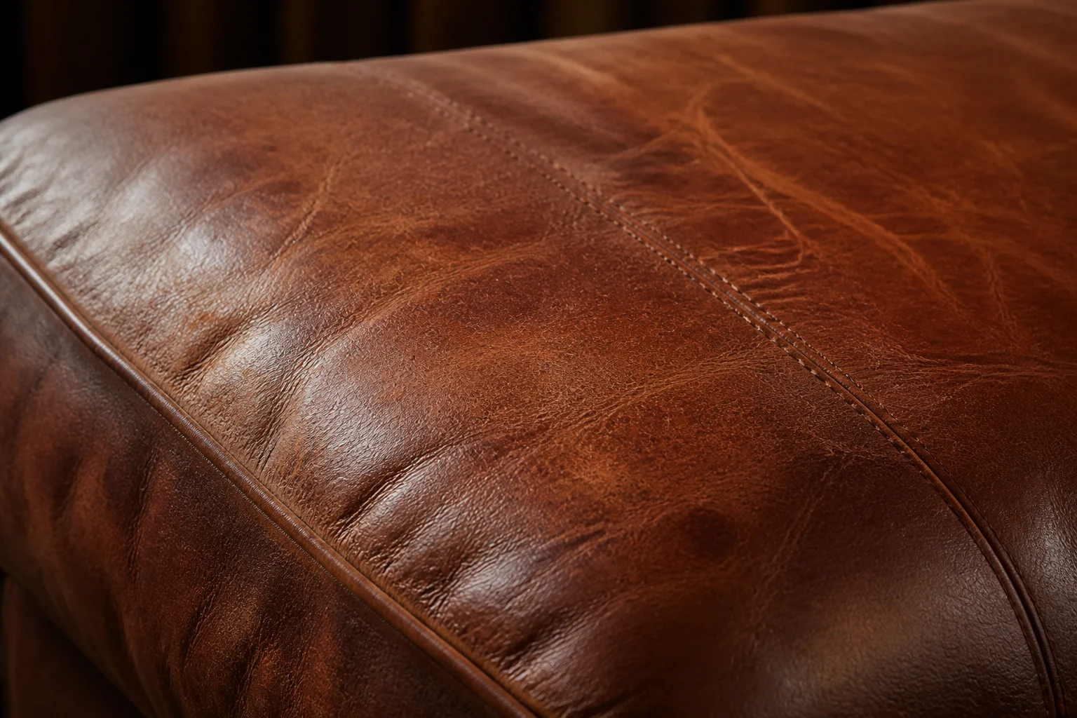 Worn cognac brown leather texture.
