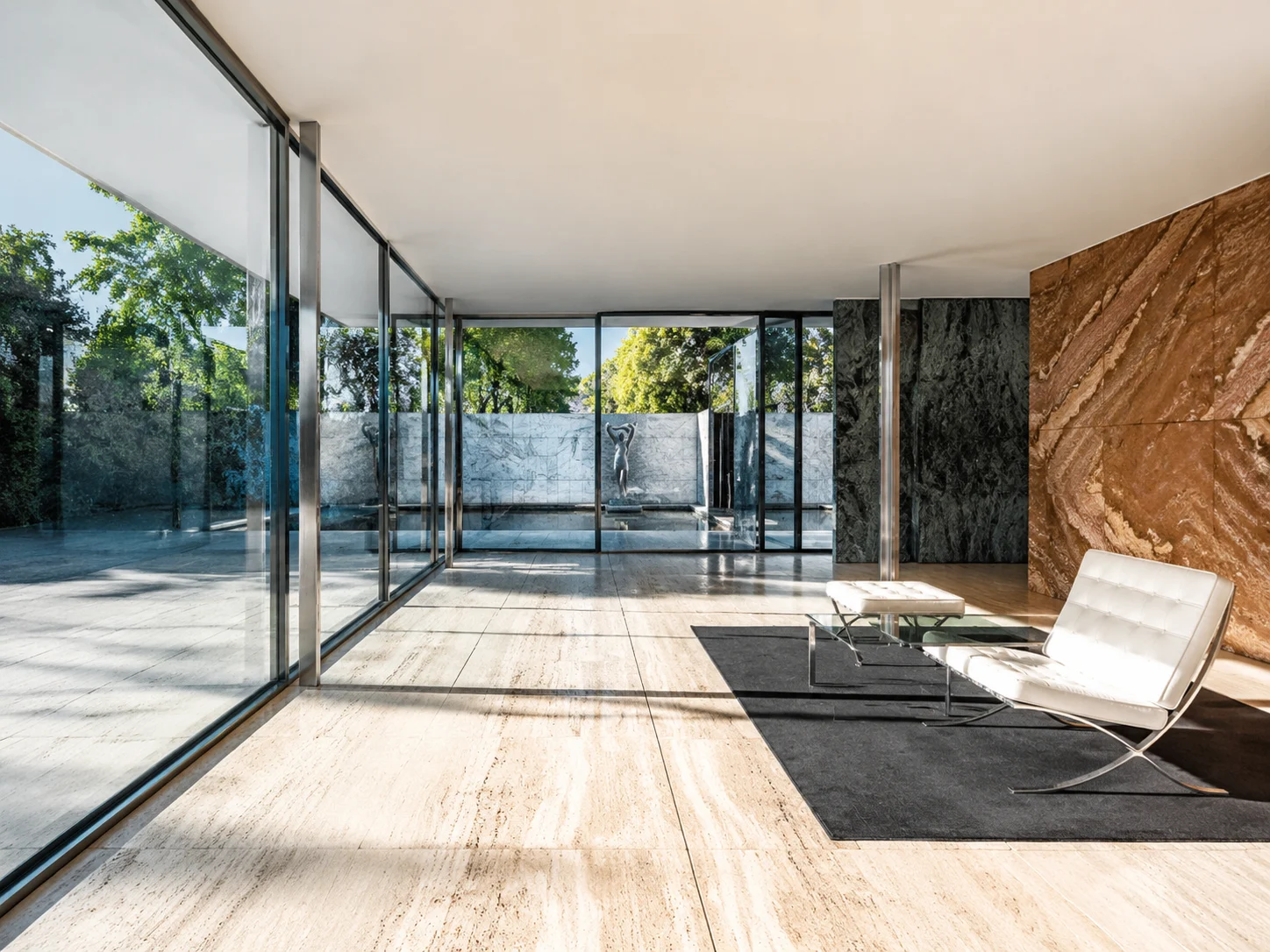 A glass-walled pavilion interior.