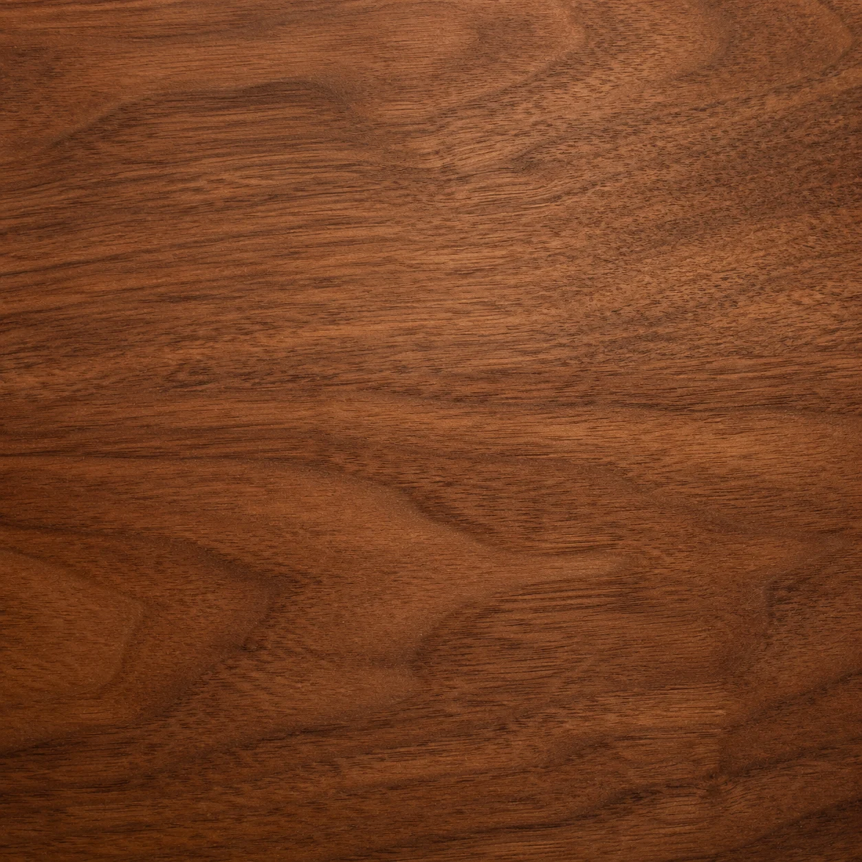 Close-up texture of walnut wood grain.