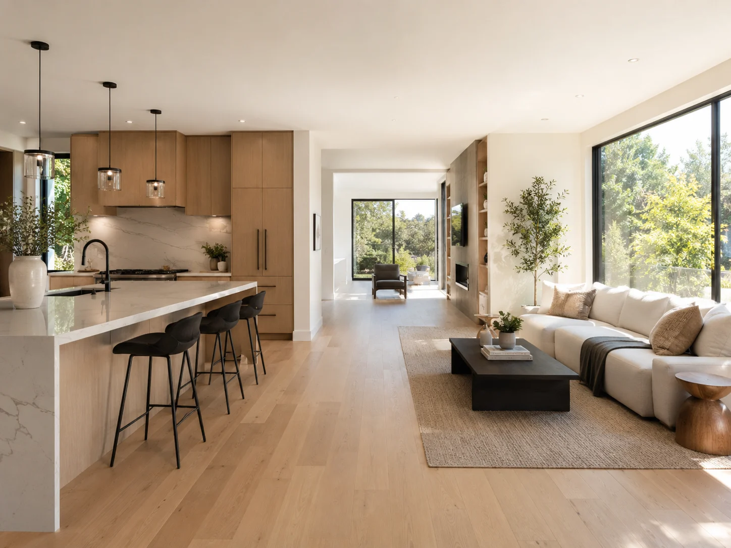 A seamless transition between a modern kitchen and living room.